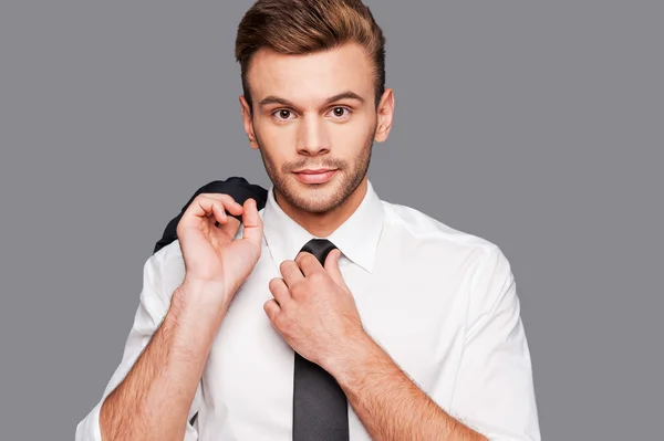 Man in formalwear adjusting his necktie — Stock Photo, Image