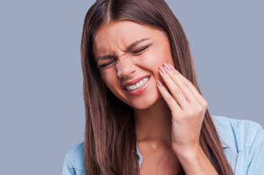 Woman suffering from toothache clipart