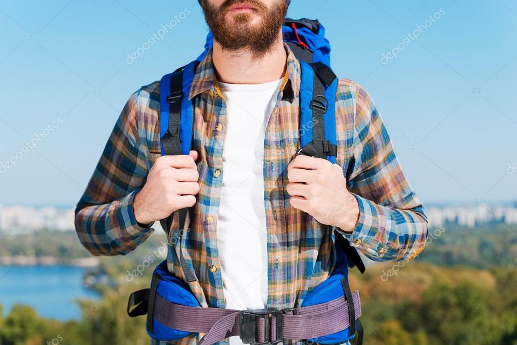 man carrying backpack
