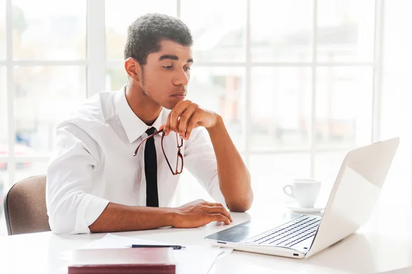 Afro-American young concentrated on work. — Stock Photo, Image