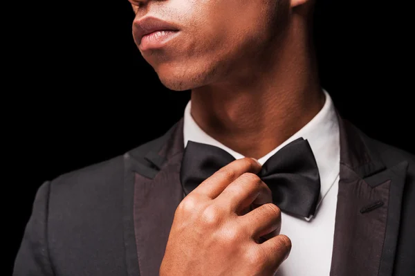 Afro-American man correcting his bow tie — Stock Photo, Image