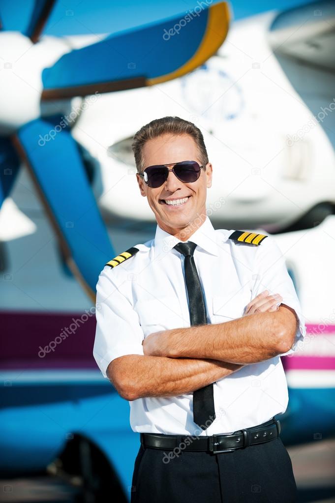 Confident male pilot in uniform