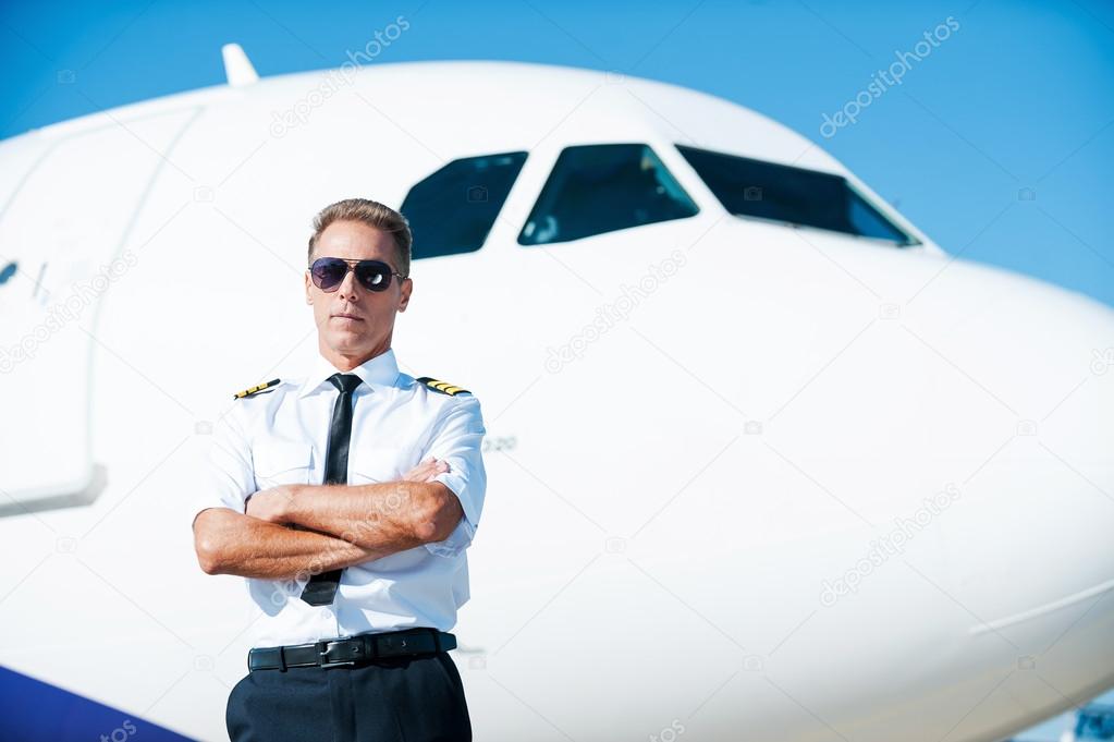 Confident male pilot in uniform