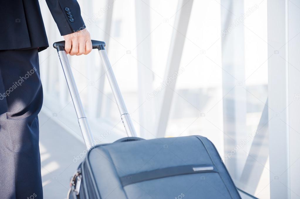 Businessman carrying suitcase