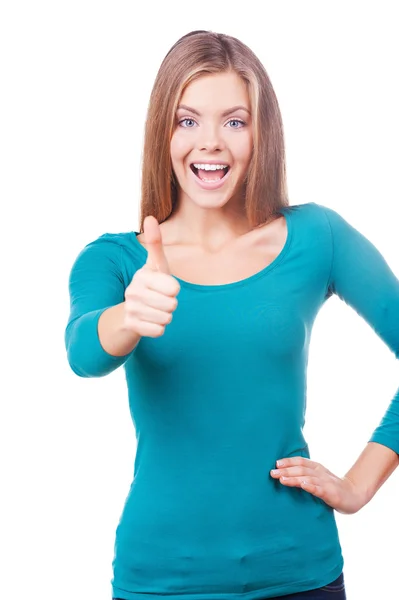 Woman looking at camera and showing her thumb up — Stock Photo, Image