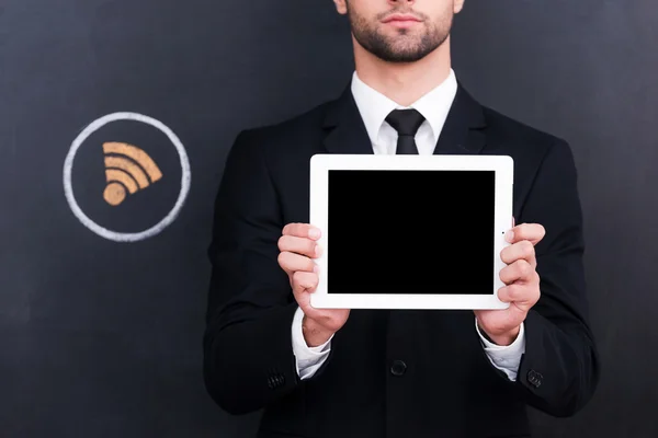 Young man holding digital tablet — Stock Photo, Image