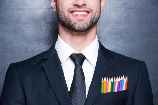 Uomo d'affari con matite colorate — Foto Stock