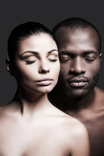 African man and Caucasian woman bonding faces — Stock Photo, Image