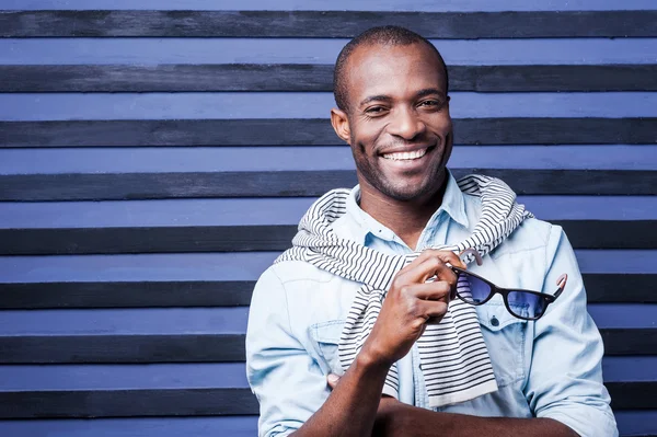 African man holding his sunglasses — Stock Photo, Image