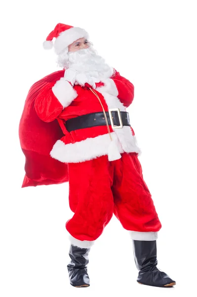 Santa Claus carrying sack with presents — Stock Photo, Image