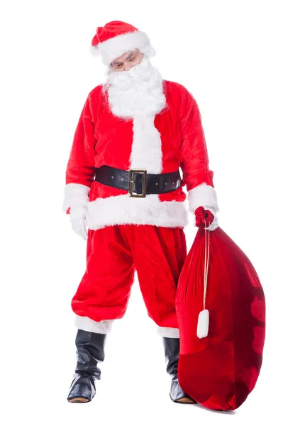 Weihnachtsmann trägt Sack mit Geschenken — Stockfoto