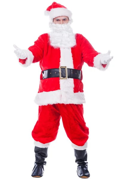 Santa Claus carrying sack with presents — Stock Photo, Image