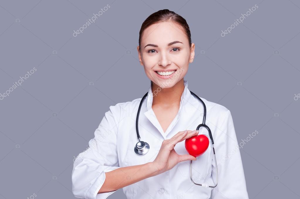 Female doctor  holding heart prop