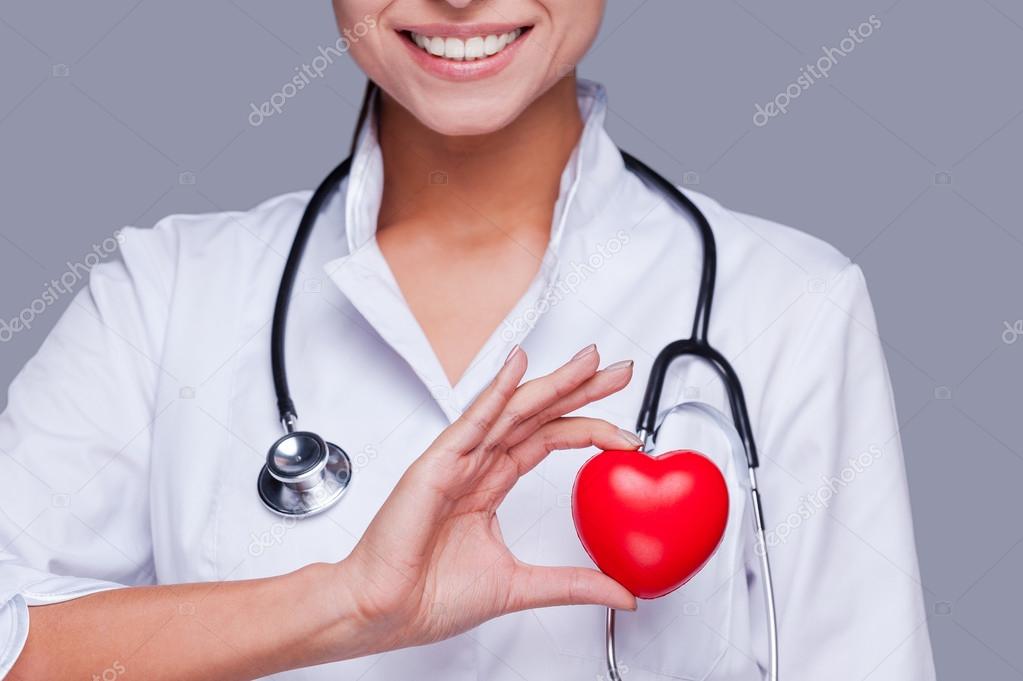 Female doctor  holding heart prop