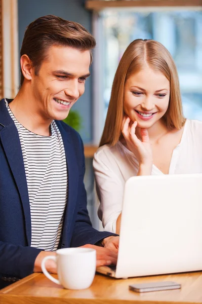 Loving couple looking at  laptop — Stock Photo, Image