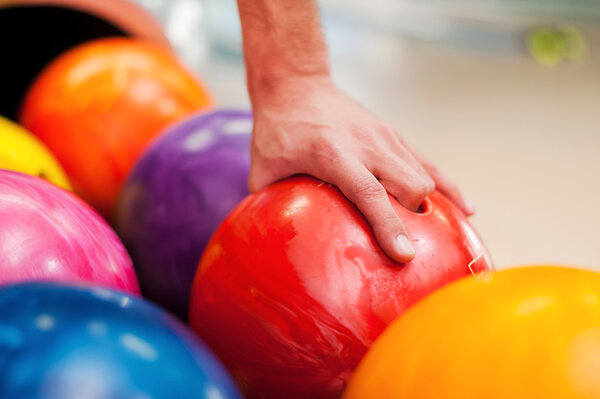 Hand holding bowling ball