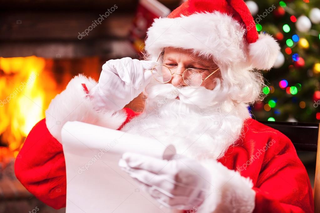 Santa Claus reading a letter