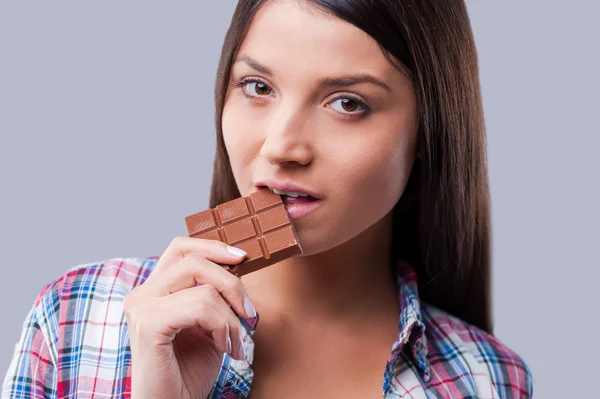 Woman tasting chocolate — Stok fotoğraf