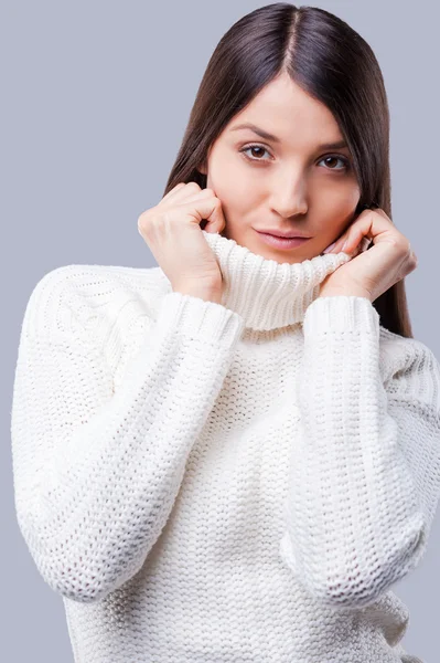 Woman covering face with turtleneck — Stock Photo, Image