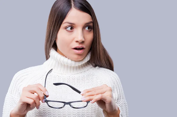 Woman in winter clothing holding glasses — Stock Photo, Image