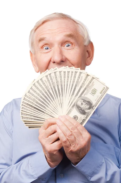 Senior man covering his mouth by money — Stock Photo, Image