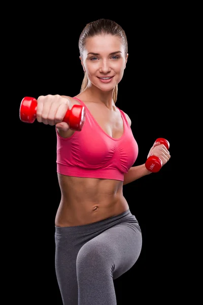 Sporty woman exercising with dumbbells — Stock Photo, Image