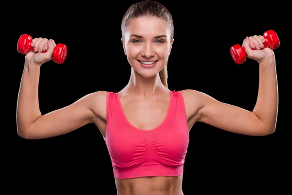 Woman exercising with dumbbell — Stock Photo, Image