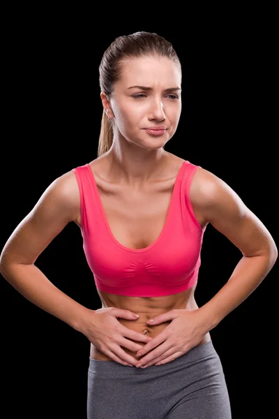 Frustrated woman touching her abdomen — Stock Photo, Image