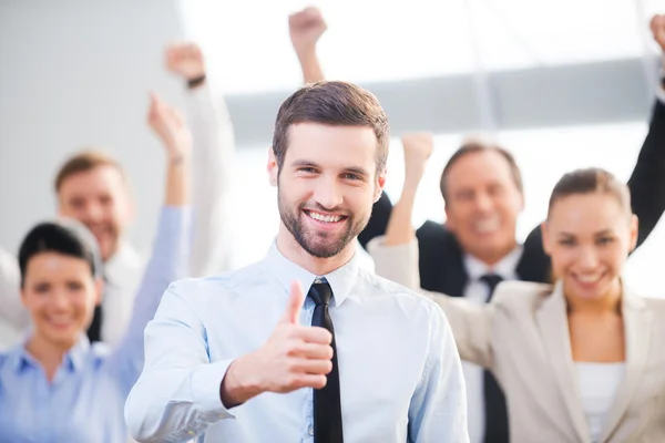 Happy businessman showing his thumb up — Stock Photo, Image