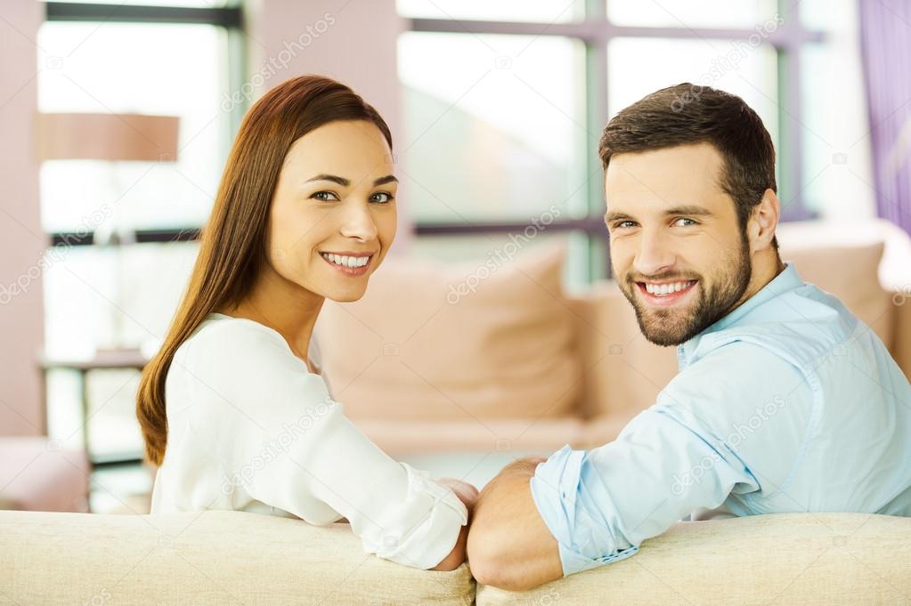 Loving couple sitting on  couch