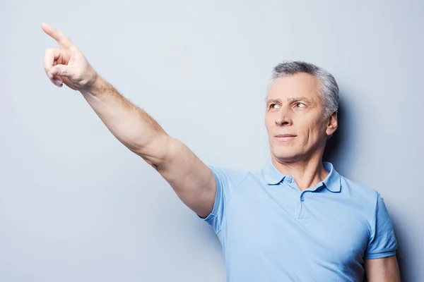 Senior man pointing away — Stock Photo, Image