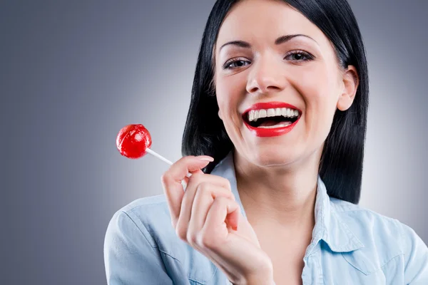 Young woman holding  lollipop — Stock Photo, Image