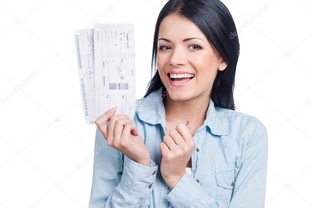 Young woman holding tickets