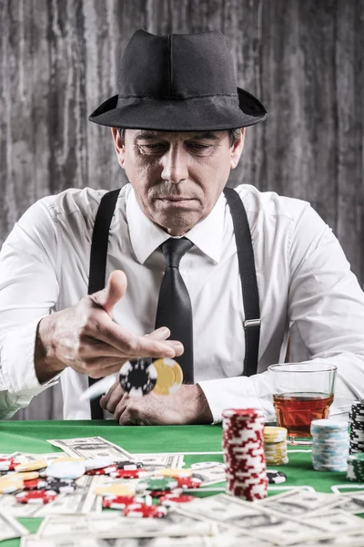 Senior man throwing gambling chips — Stock Photo, Image