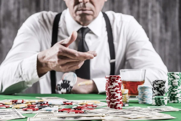 Senior man throwing gambling chips — Stock Photo, Image