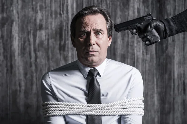 Tied up businessman caught by criminal — Stock Photo, Image