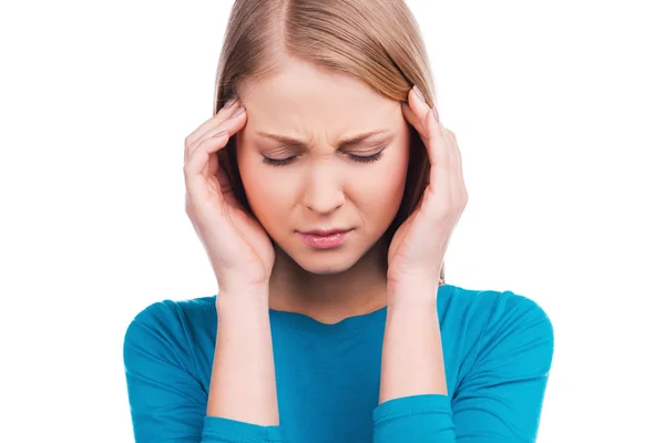 Woman touching her head and keeping eyes closed — Stock Photo, Image