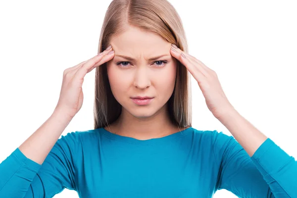 Woman holding her fingers on the temples — Stock Photo, Image