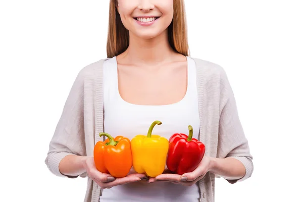 Young woman holding peppers — Stock Photo, Image