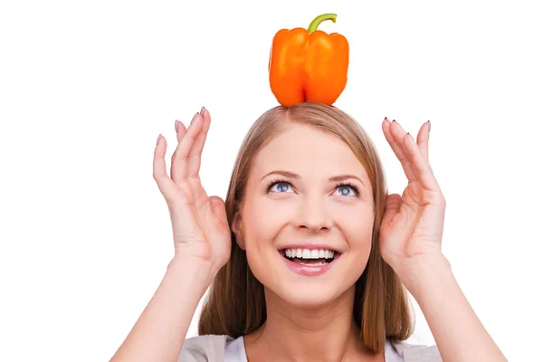 Woman with salad pepper on her head — Stock Photo, Image