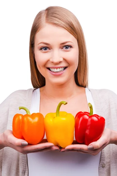 Young woman holding peppers — Stock Photo, Image