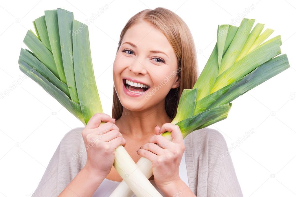 Woman holding leeks in hands