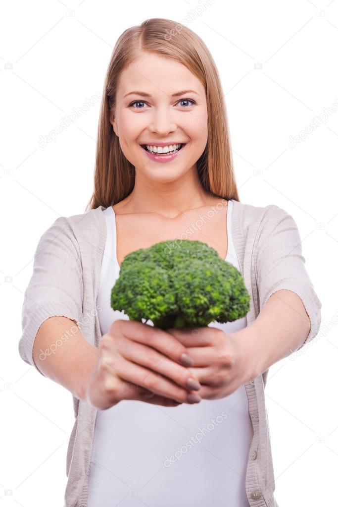 Woman stretching out broccoli