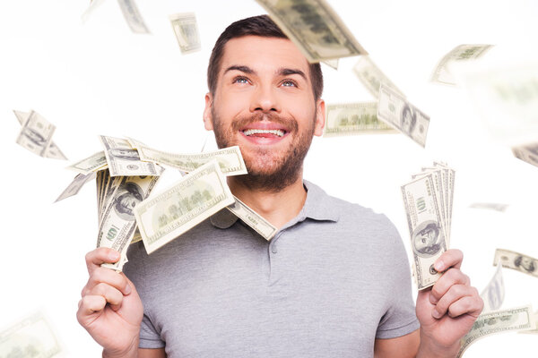 Happy man holding paper currency