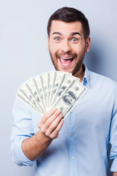 Man holding paper currency — Stock Photo, Image