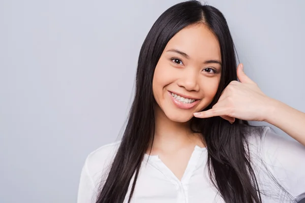 Asian woman gesturing mobile phone — Stock Photo, Image