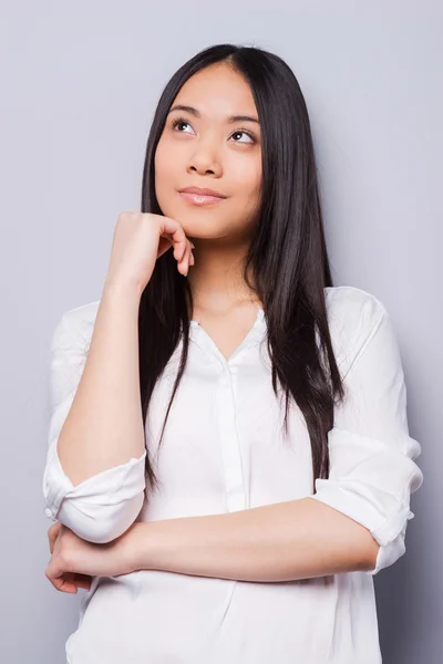 Thoughtful young asian woman — Stock Photo, Image