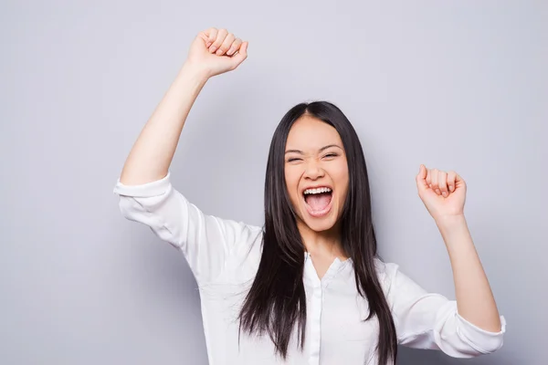 Asian woman keeping her arms raised — Stock Photo, Image