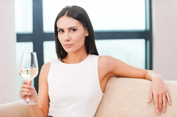Woman holding glass with wine
