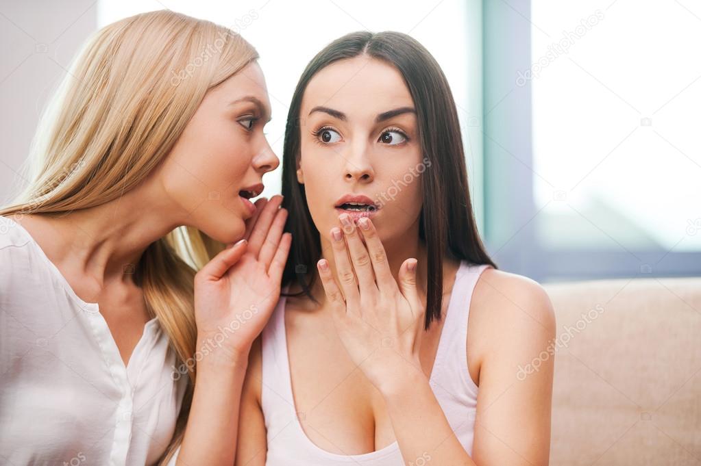 Young women gossiping